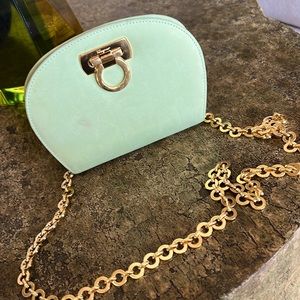 Salvatore Ferragamo, green Gancini Diana Clutch with gold hardware.
